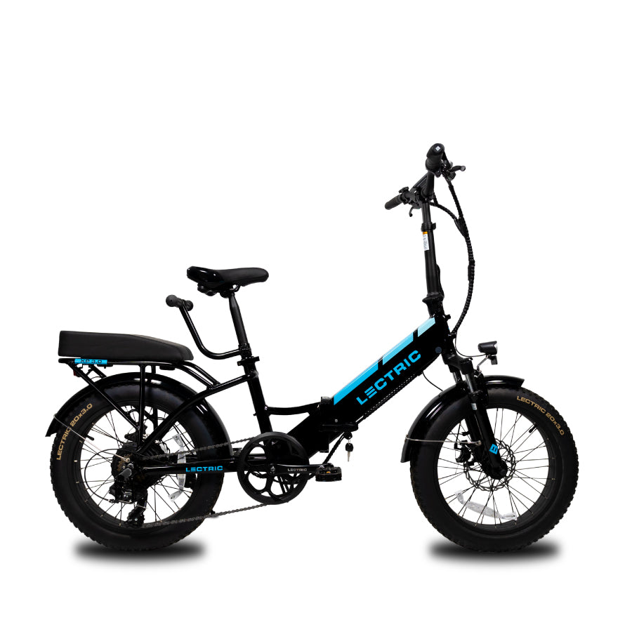 side-view of a black XP Step-Thru 3.0 with the passenger package accessory installed on the rear rack