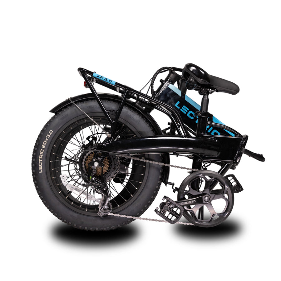 Black XP Lectric eBike folded with shadow showing drive side of bike Folded pedals