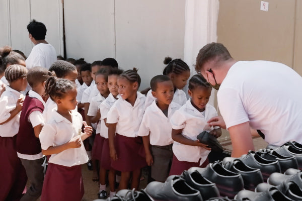 Kids at a shoe drive