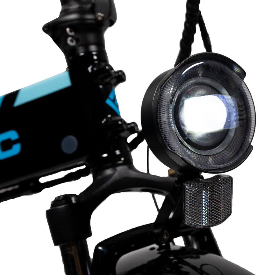 close-up of the elite headlight accessory installed on a Lectric eBike turned on against a white background