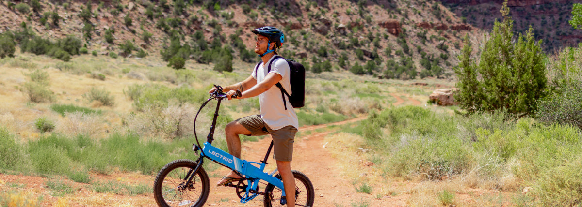Man Riding a Blue Lectric XP Lite eBike along trail in Zion