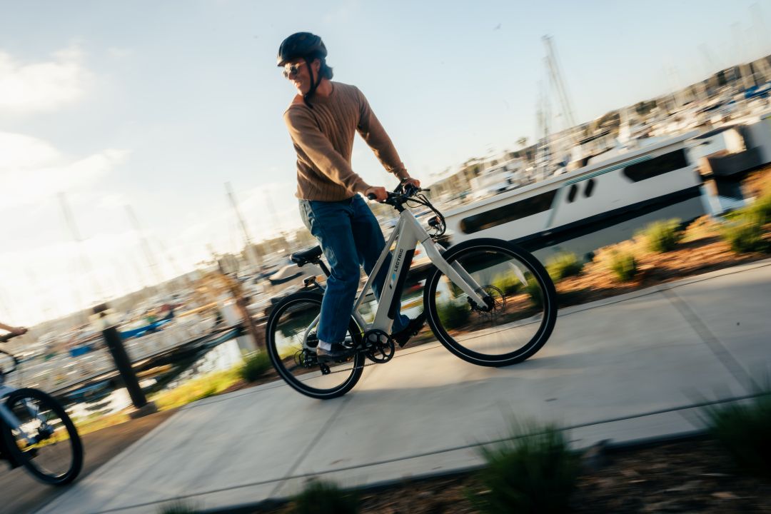 guy riding an xpress lite bike by the bay