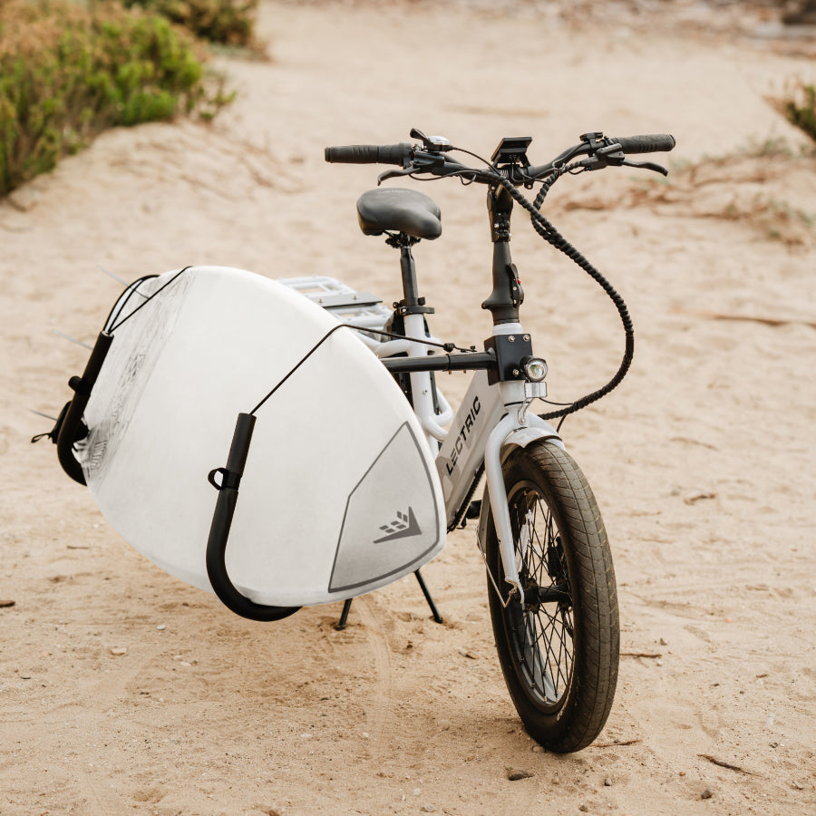 Surfboard store bike attachment