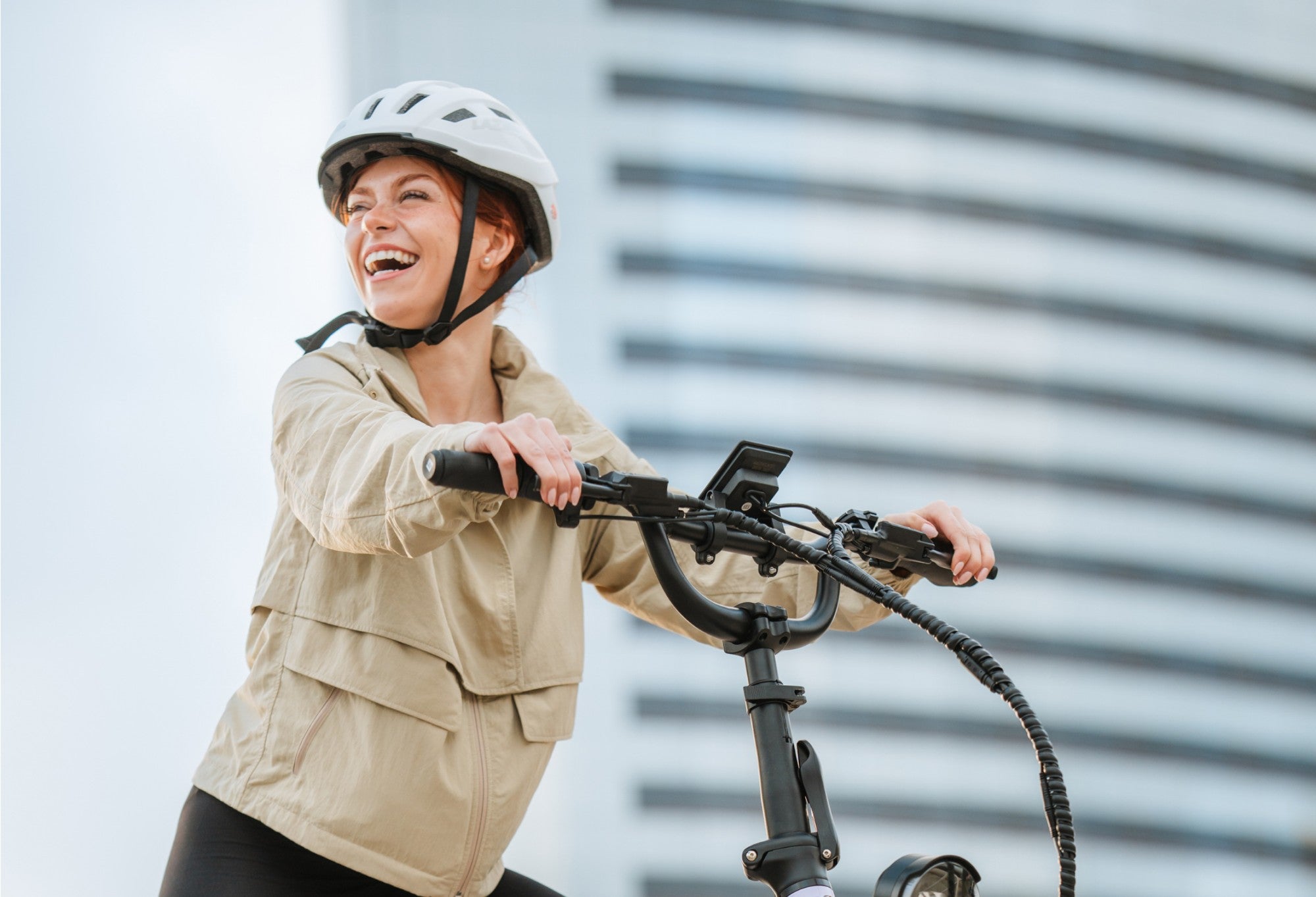 Woman with smile rides bike