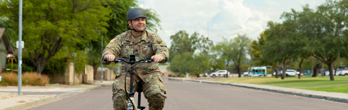 Member of the Military Riding a Lectric eBike XP Lite in a neighborhood