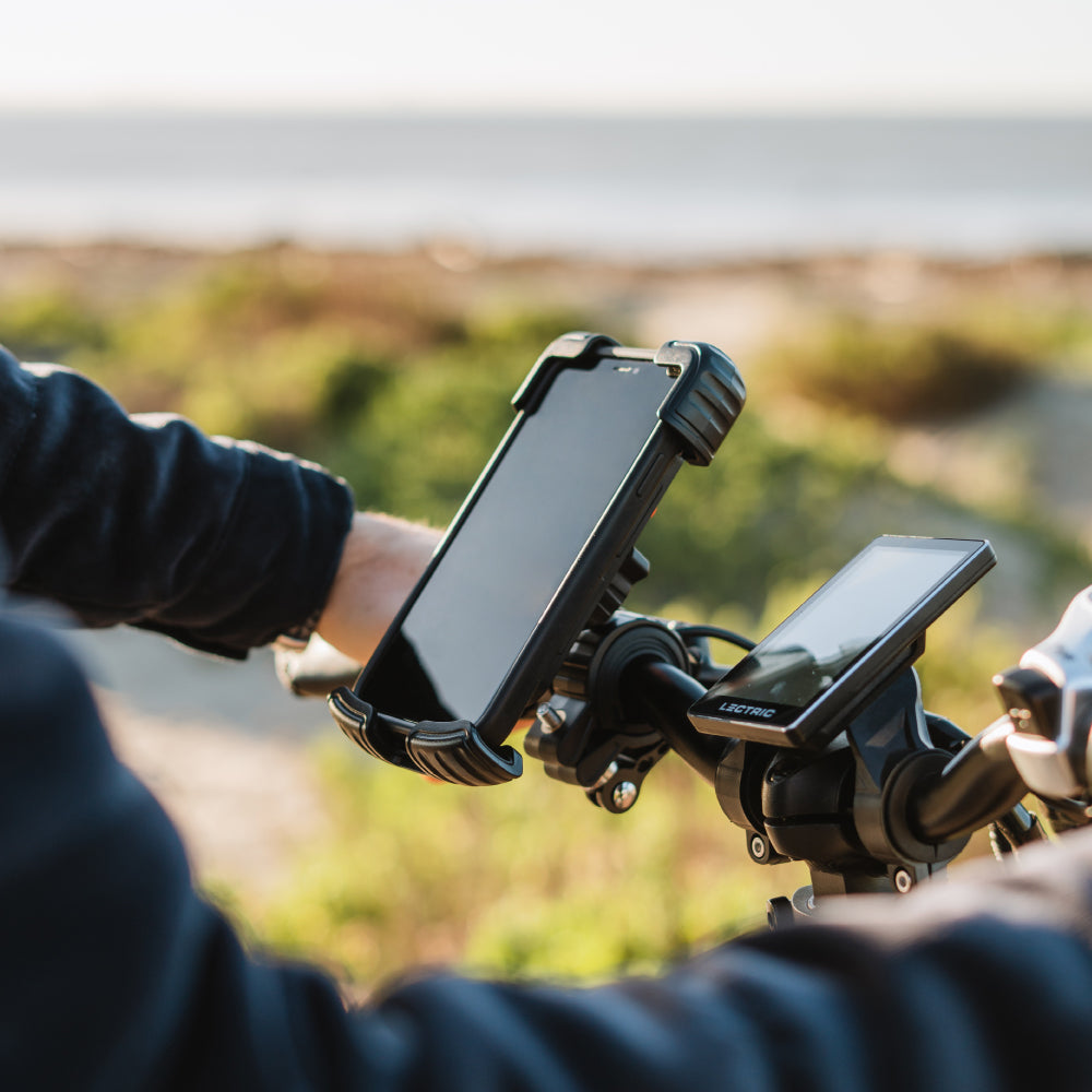 phone mount holding phone on ebike handlebars