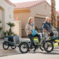 man and woman riding XP Trike and XP 3.0 in neighborhood with Wag Along pet carrier
