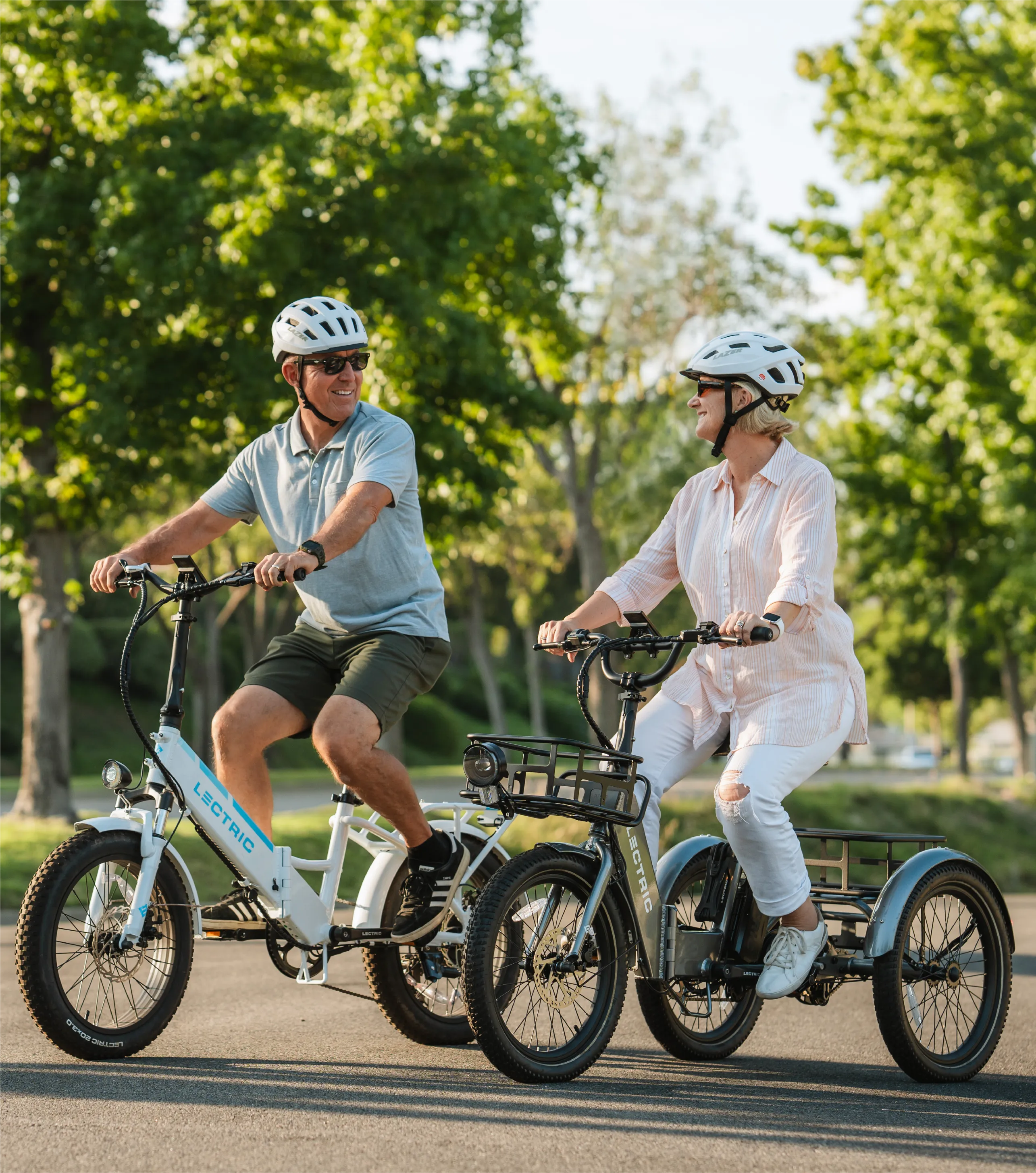 Two seniors riding an XP 3.0 and XP Trike together down the street