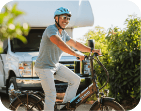 senior in front of rv on ebike