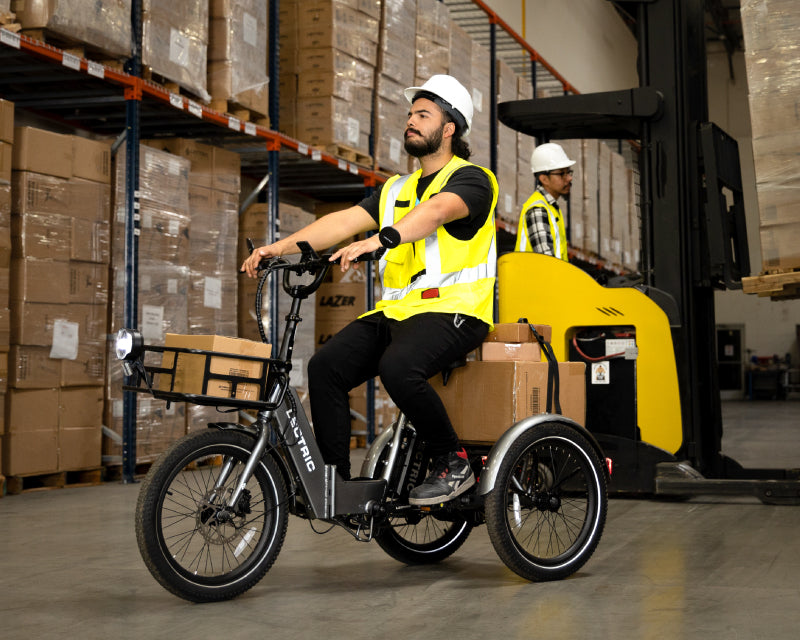 warehouse worker riding XP Trike through warehouse halls