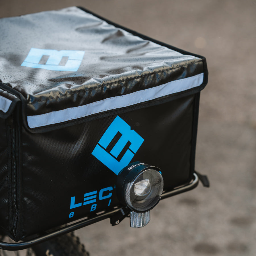 lectric ebike with insulated food box mounted on front rack