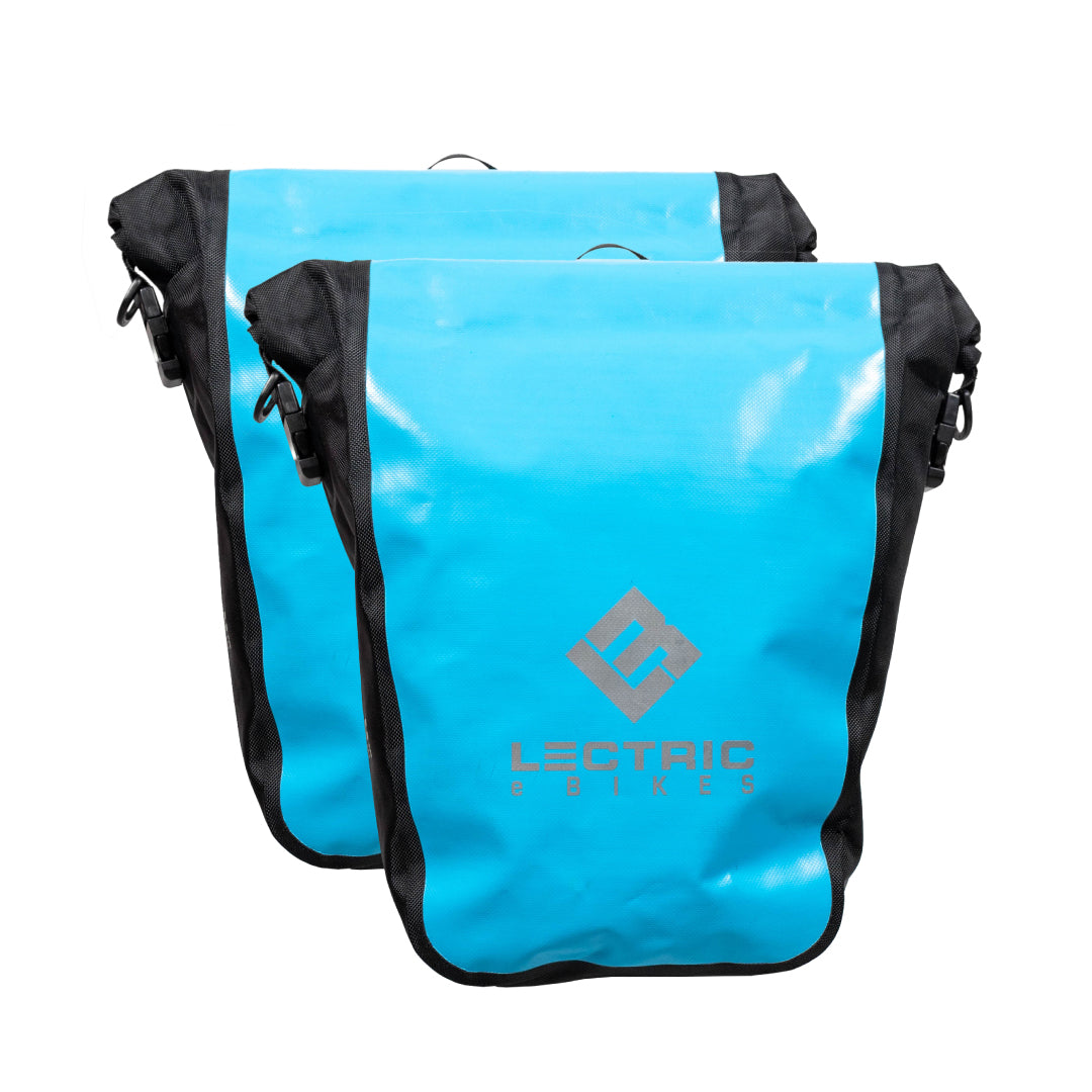 2 blue waterproof rear rack pannier bags on a white background 